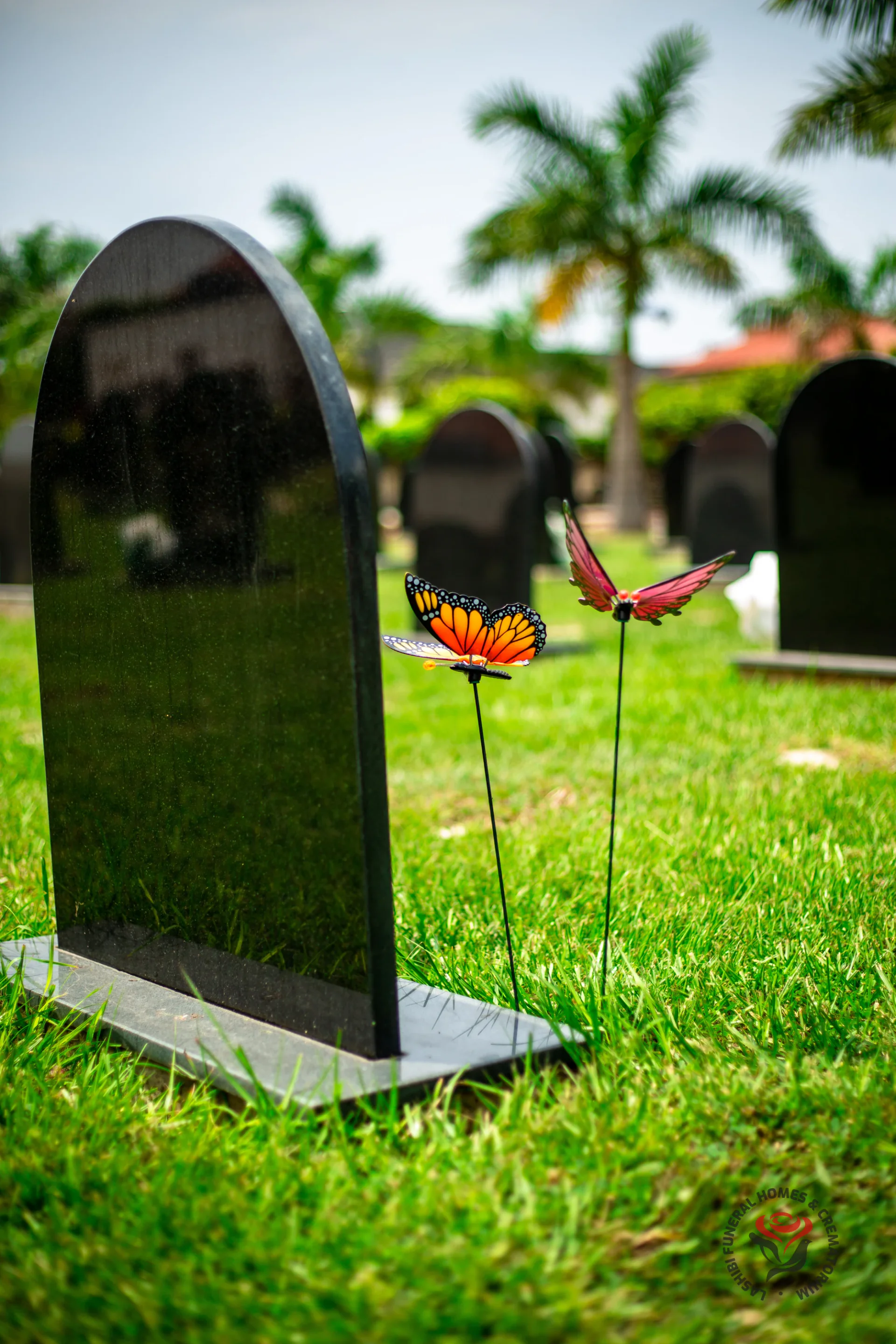 A headstone amid the gardens